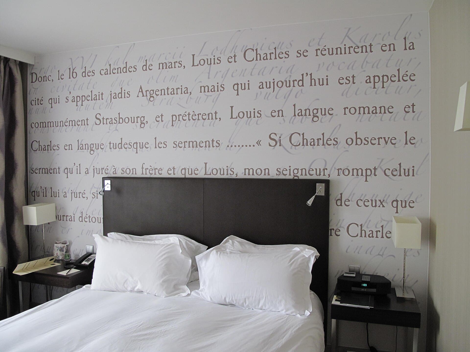 Room photograph — a bed made up as Pocket Elite 28 would be. Not a photograph of the unit itself.